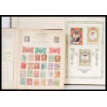 An early 20th Century stamp album containing stamps dating from the 19th Century from all around the