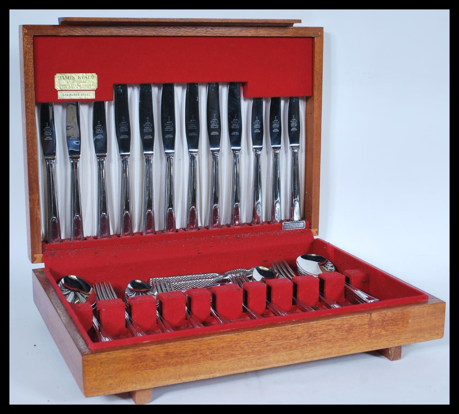 A vintage 20th Century James Ryals stainless steel canteen of cutlery in fitted wooden case. 9cm