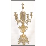A 19th century, French large rococo revival brass gilt table five point candelabra centrepiece,