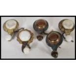 A collection of five antique Edwardian interior bell pulls having brass body and ceramic knob handle