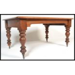 A 19th Century Victorian mahogany library table, inset red leather gilt tooled skiver,  circa