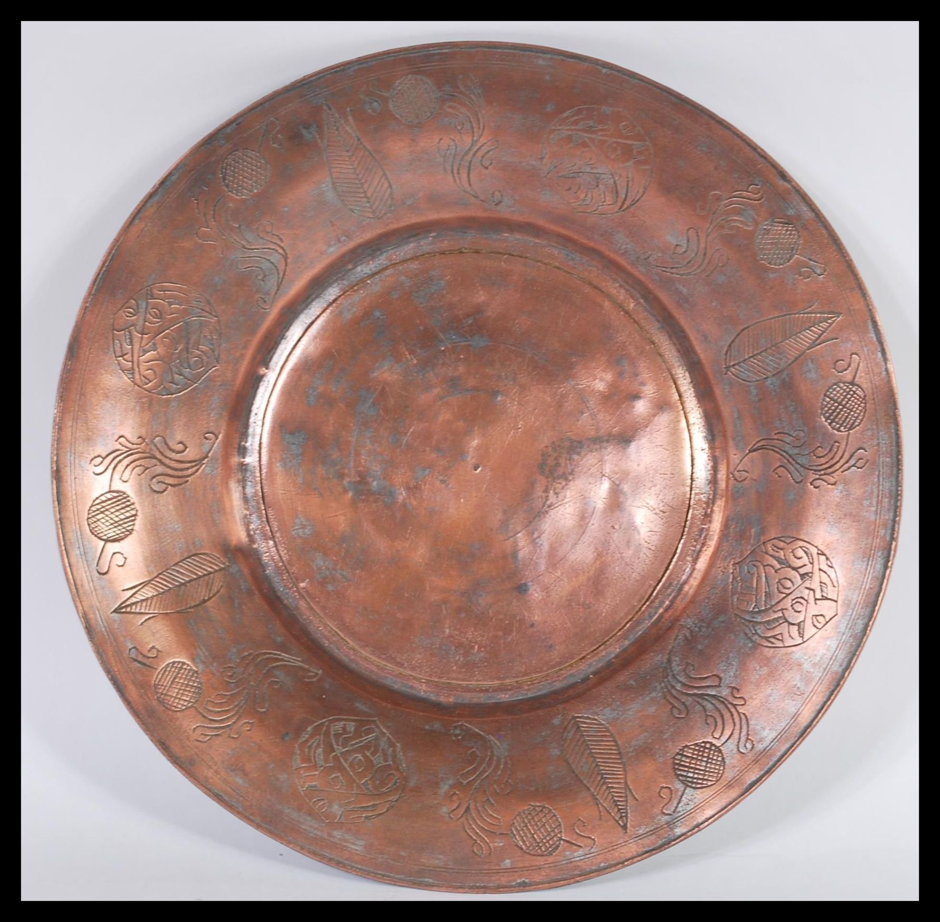 A 19th Century Middle Eastern Persian Islamic copper wall charger plate tray. The central well