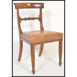 A 19th century Regency Gillows of Lancaster mahogany and leather desk chair.  Fluted and reeded legs