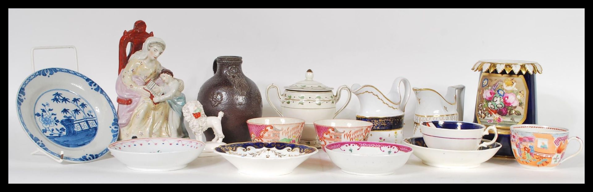 A collection of mixed ceramic items dating from the 18th Century to include two Chinese tea bowls