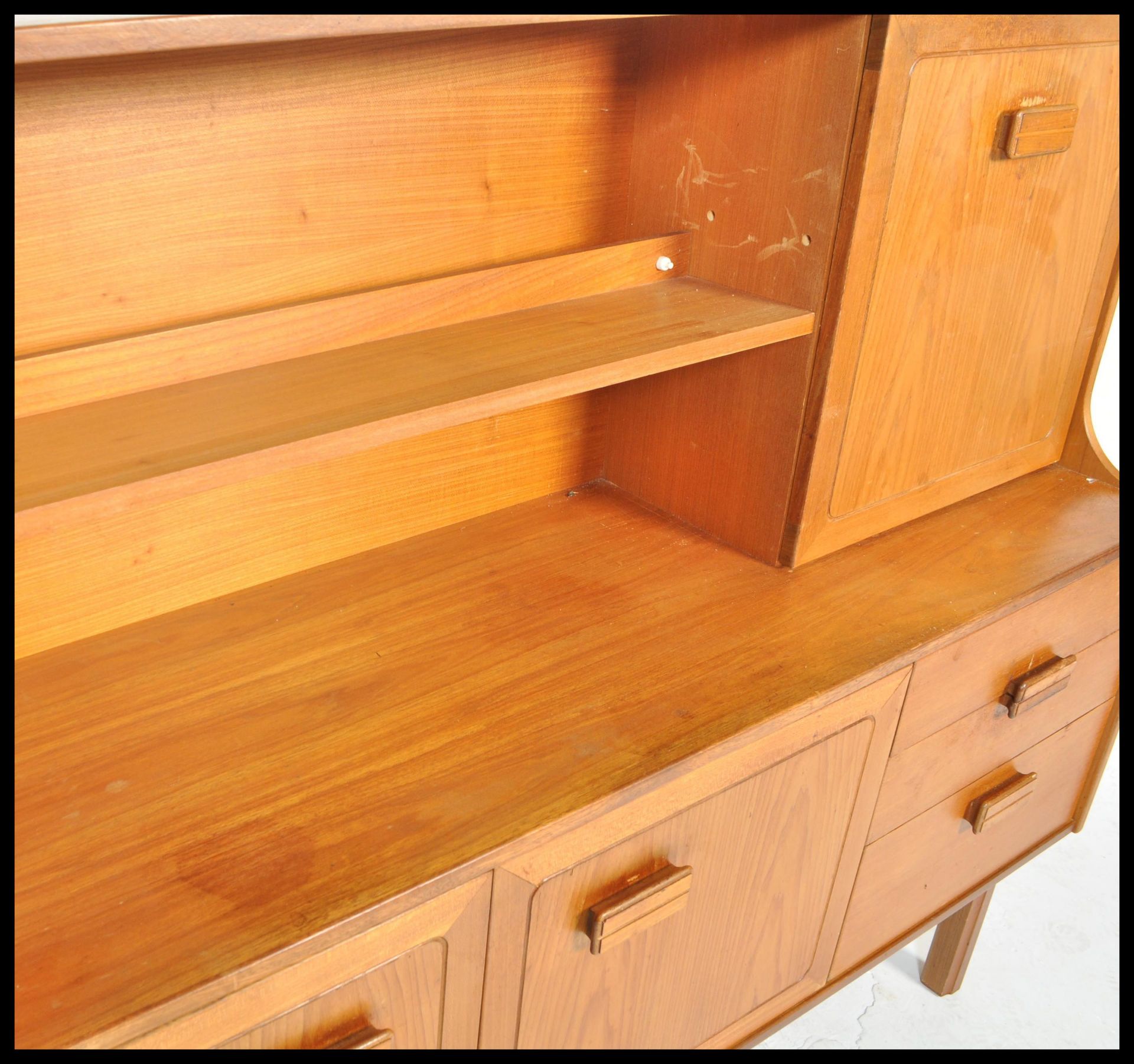 A retro 20th Century teak wood highboard sideboard credenza by Alfred Cox having an arrangement of - Image 4 of 6