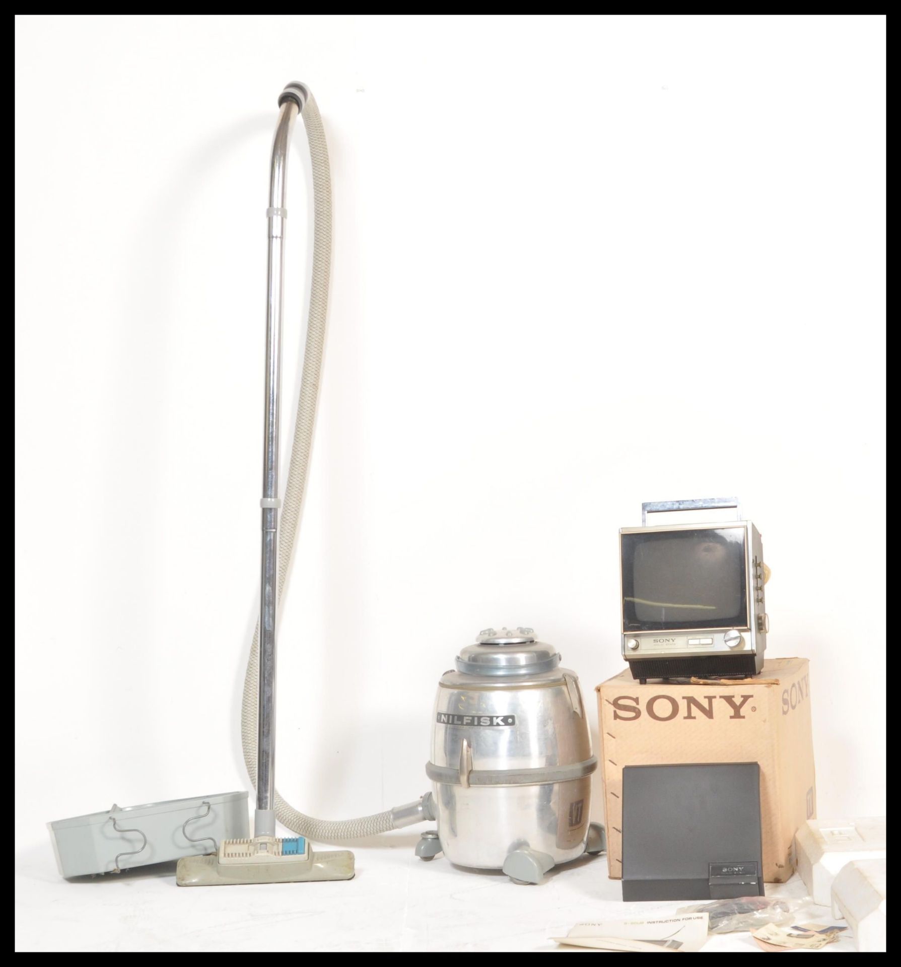 A vintage retro Sony 9-90UB black and white portable television in original box with accessories,