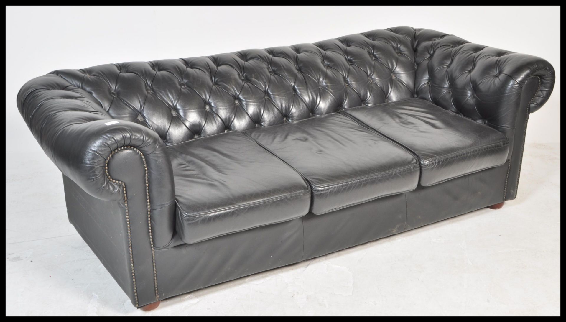 A contemporary black leather button back three seater Chesterfield sofa with button back and - Image 2 of 5