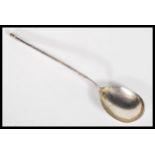 A 19th Century Russian silver coffee / tea spoon having an elongated stem with central twist.