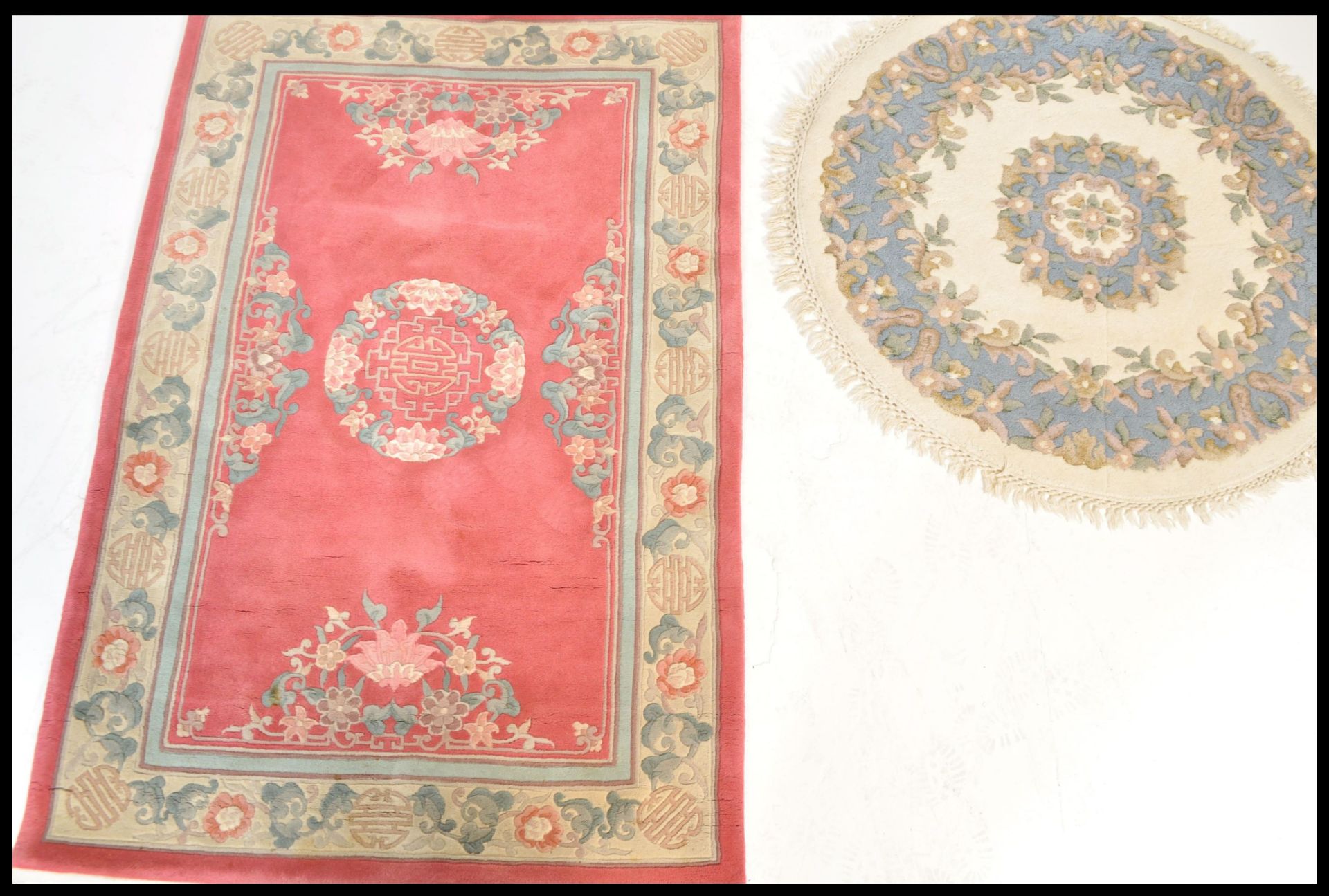 Two 20th Century Contemporary Chinese floor carpet rugs to include a circular one with white