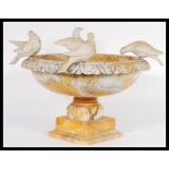 A 19th century Grand Tour alabaster centrepiece bowl / raised tazza adorned with doves to the