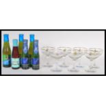 A collection of seven retro and vintage Babycham advertising point of sale glasses together with a