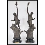 A pair of 19th century Art Nouveau French spelter figurines kneeling on stags, each with notation