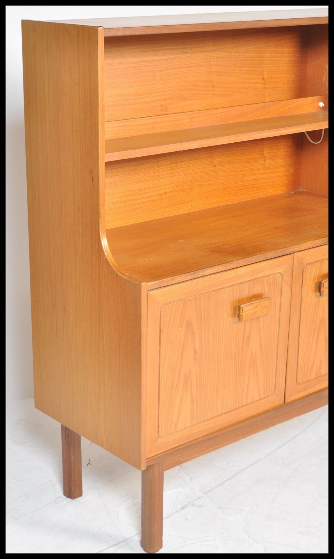 A retro 20th Century teak wood highboard sideboard credenza by Alfred Cox having an arrangement of - Image 3 of 6