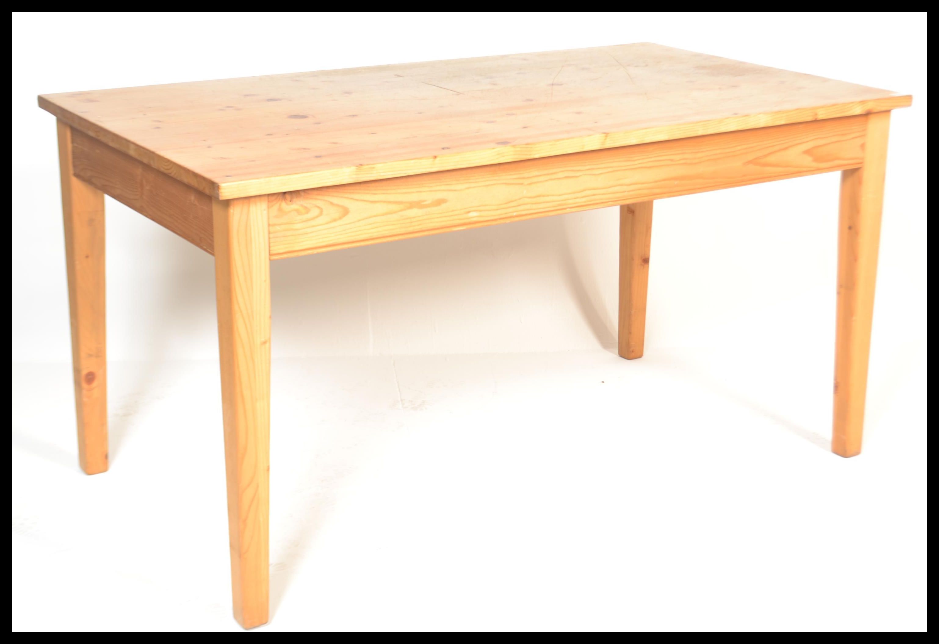 A 20th century antique style pine farmhouse dining table of rectangular form with thick plank top, - Image 2 of 4
