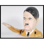 A WWII related vintage cast iron cold painted novelty nut cracker in the form of Adolf Hitler having