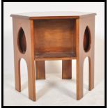 A 19th century Victorian  Arts & Crafts mahogany. Raised on arched supports with pierced teardrop