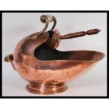 A fantastic 19th Century Victorian Art Nouveau copper coal scuttle having alabaster handle