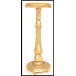 A gilt ormolu painted pedestal bust or jardiniere torchere stand raised on circular base with
