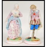 A pair of early 20th Century French Continental Bisque ware figurines depicting a courting couple.