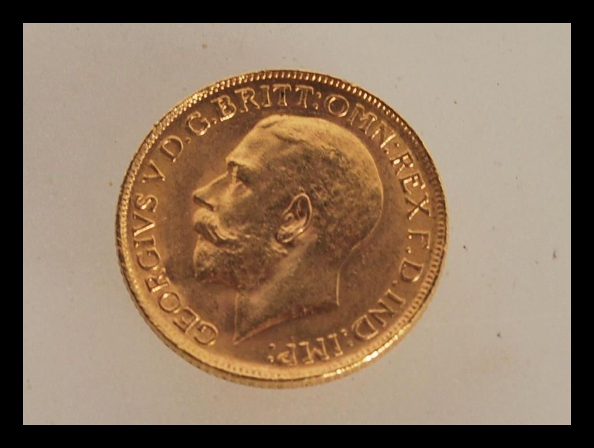A 22ct gold sovereign dated 1911 with George and the dragon to one side and George V facing left