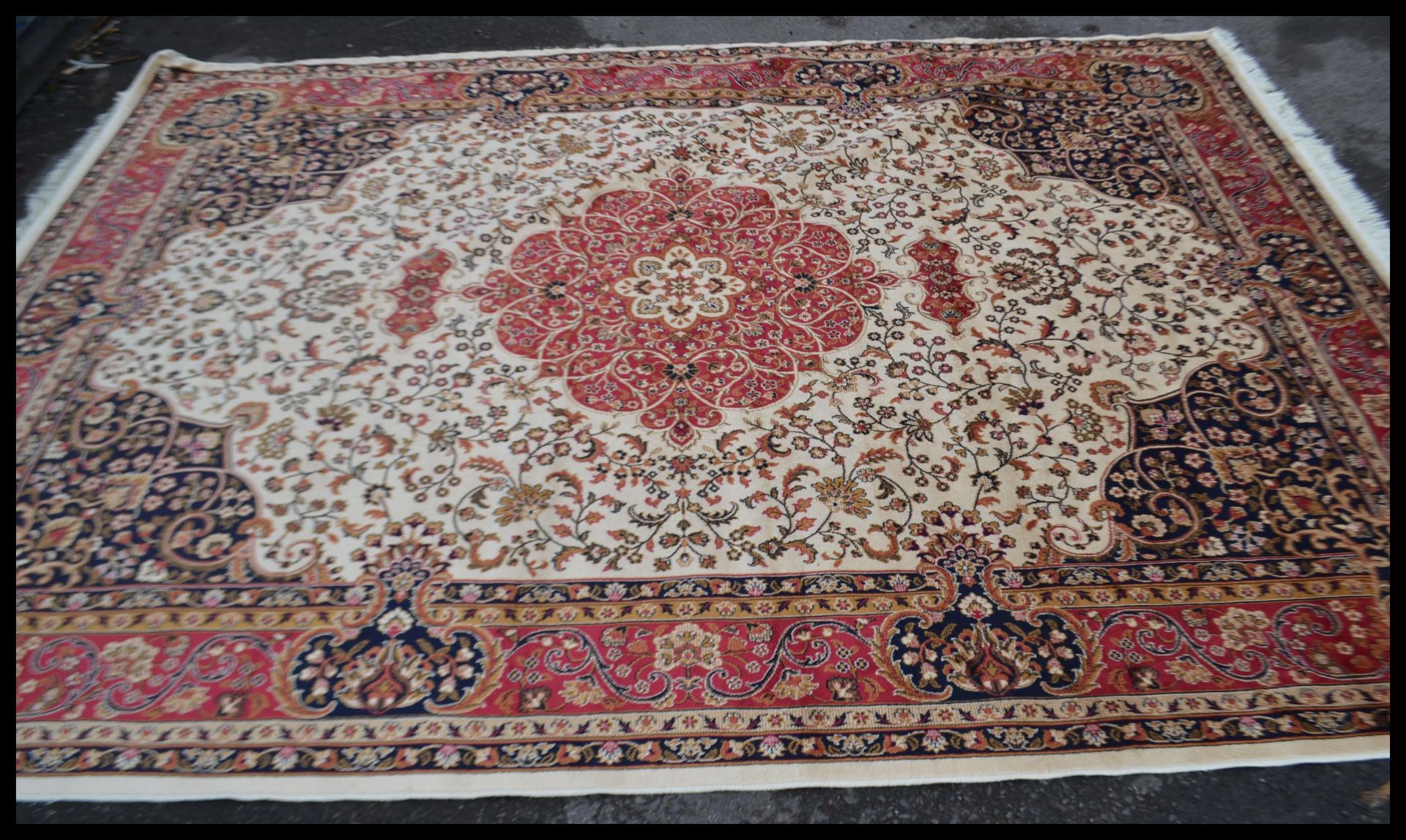 A large Persian floor carpet Keshan rug having a b