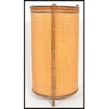 A 19th Century Victorian Aesthetic movement bamboo and wicker basket of cylindrical form having