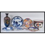 A collection of Chinese and Japanese ceramics to include a large planter decorated with peonies,