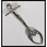 A pair of Novelty Art Nouveau silver plated sugar tongs in the form of an exercising gentleman,