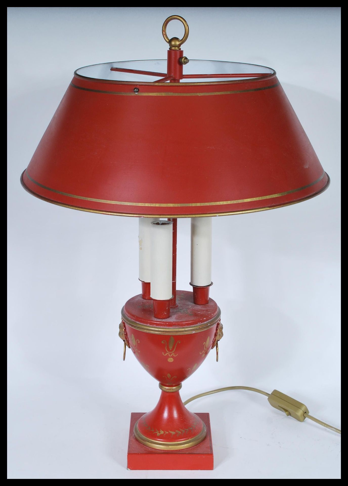 A Louis XVI Bouillotte three light candelabra coaching lamp on a round base with a terracotta