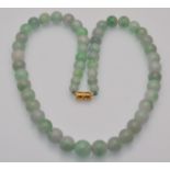 A jadeite bead necklace having screw clasp. Untrea