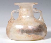 EARLY ANCIENT GLASS DOUBLED HANDLED VESSEL
