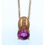 A pink sapphire and diamond pendant, the oval ston