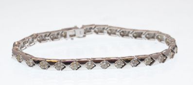 14CT WHITE GOLD AND DIAMOND BRACELET HAVING APPROX