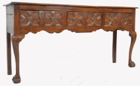 A GEORGE III COUNTRY OAK GEOMETRIC MOULDED DRESSER