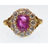 18CT GOLD RUBY AND DIAMOND CLUSTER RING