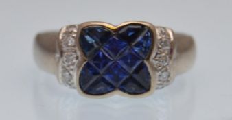 An 18ct gold sapphire and diamond ring. The ring h