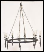 A large 20th Century ebonised iron ceiling light chandelier having eight ebonised sconces with