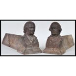 A pair of 19th Century Georgian cast iron fire dogs having busts to the ends modelled as the bust of