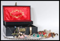 A collection of vintage costume jewellery within a leather jewellery box to include ladies