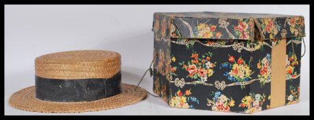 A mid 20th Century straw boater hat with black ribbon, Made in England by Dunn and Co, size 58.