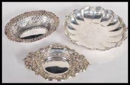 A group of three hallmarked silver bon bon dishes to include a 19th Century Victorian Deakin and