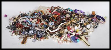 A collection of vintage and contemporary costume jewellery to include necklaces, bracelets,