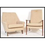 A 20th century Parker Knoll armchair being raised on tapering legs with a-frame style having the