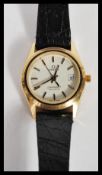 A vintage ladies Omega Seamaster Quartz watch set to a leather strap. The white enamel face having