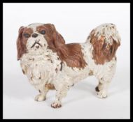 An Austrian cold painted bronze figurine in the form of a dog in the manner of Bergman having