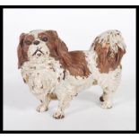 An Austrian cold painted bronze figurine in the form of a dog in the manner of Bergman having