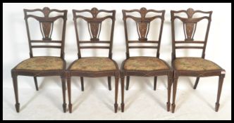 A set of four Edwardian marquetry seaweed inlaid m