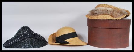 A group of three vintage / retro ladies hats to include a straw hat by Laura Ashley, another straw