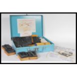 A vintage ' Dalton Kleermark ' cold cattle branding kit containing wooden and rubber block number