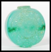 A 19th Century Chinese Jade bi disc snuff or perfume bottle of circular form with character marks